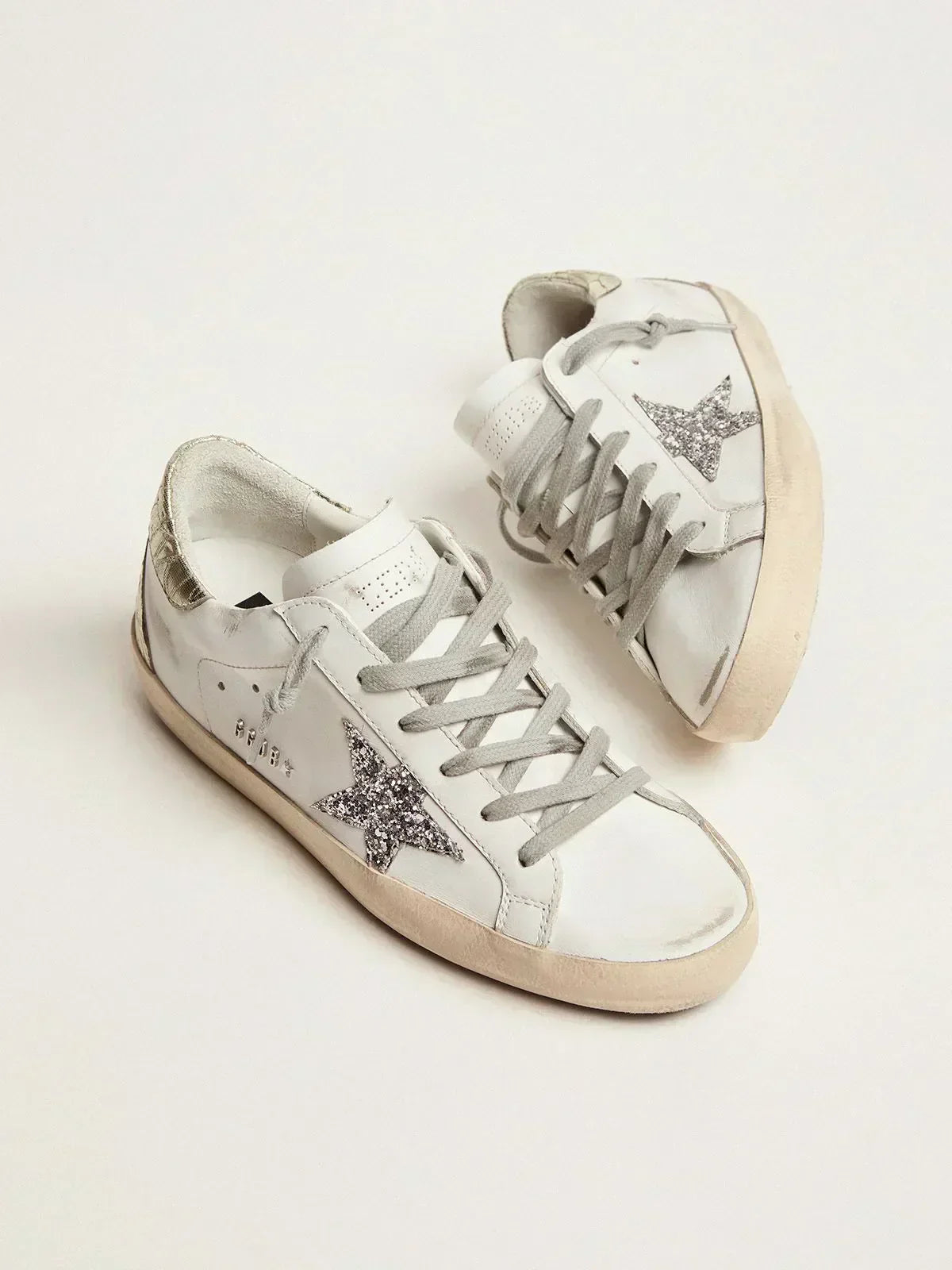Super-Star sneakers with silver glitter star and glossy gold leather heel tab
