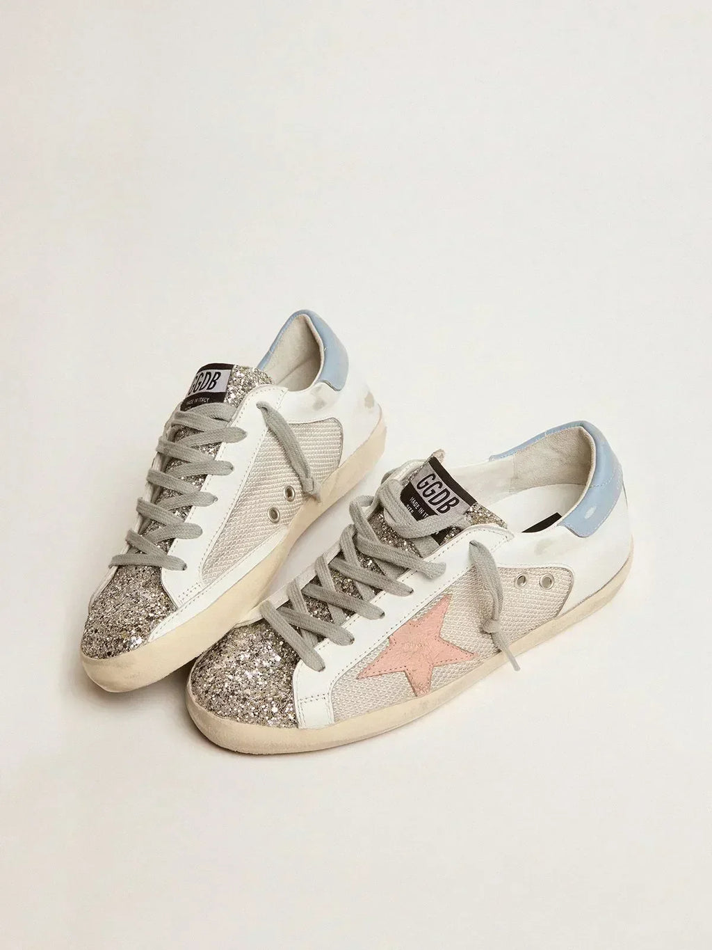 Sneakers Super-Star LTD in pelle bianca con inserto in mesh e linguetta glitter argento 