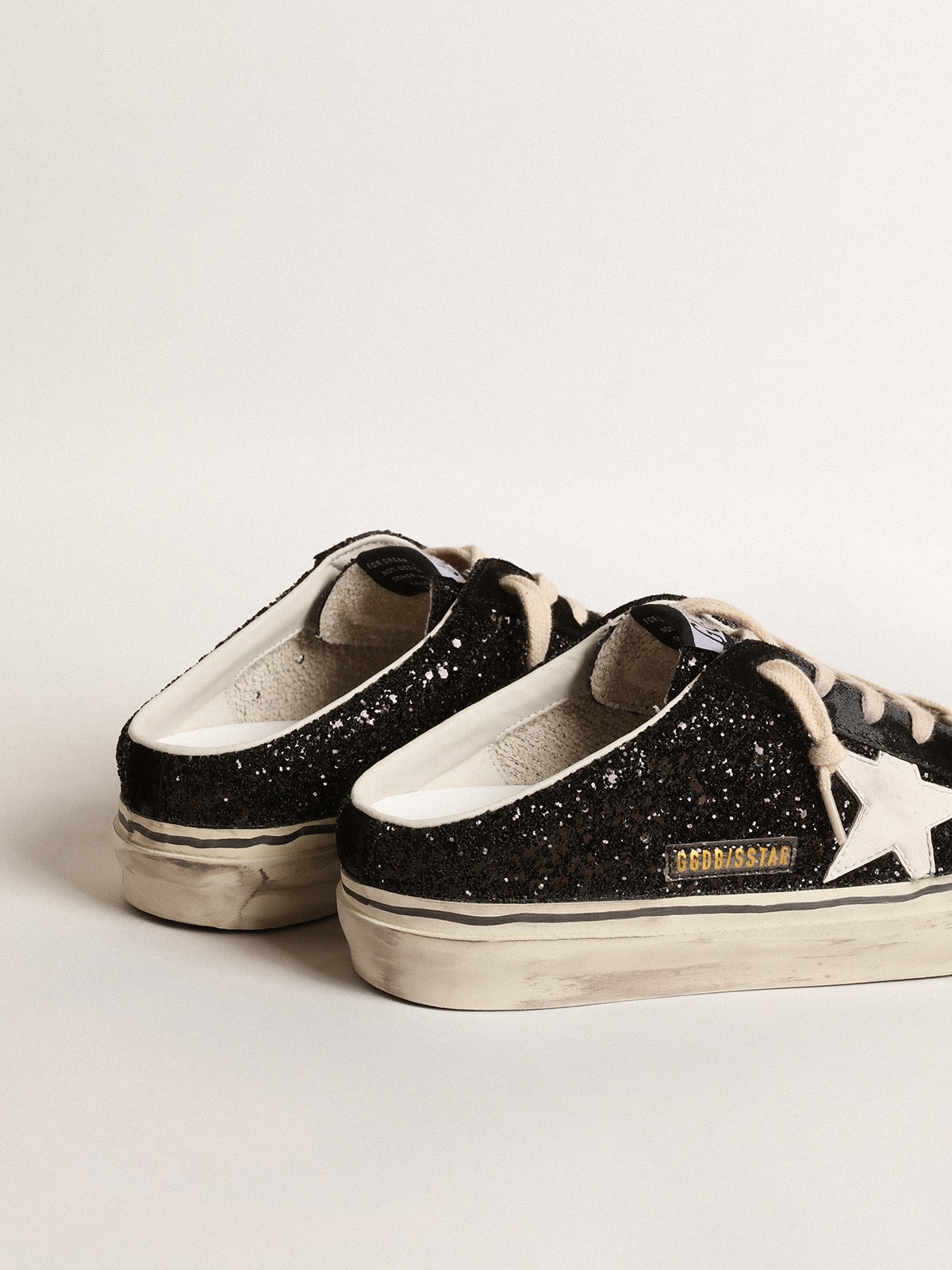 Sabot Super-Star in glitter nero con stella bianca bio-based