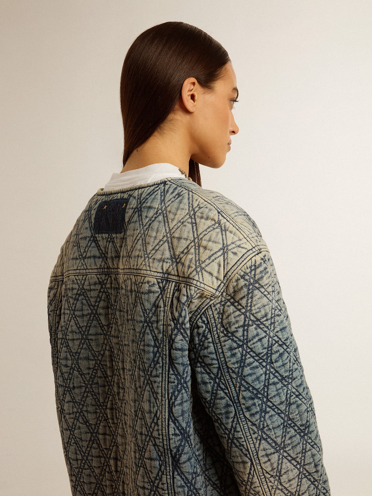 Women's blue quilted jacket in cotton denim with distressed finish